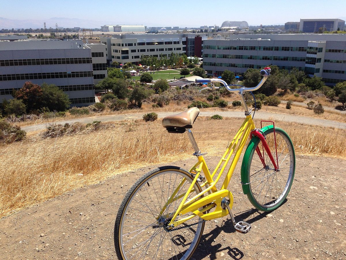 A bicycle on Crittenden Hill, looking over office campuses toward NASA Ames